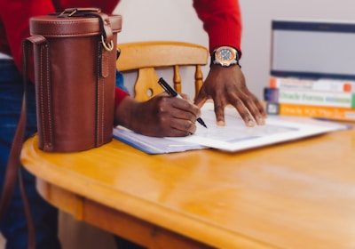 Person writing on paper